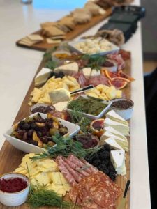 Ask Denise about ordering a tasty charcuterie board paired with your favorite wine before you arrive and we will pick up and deliver it for you.