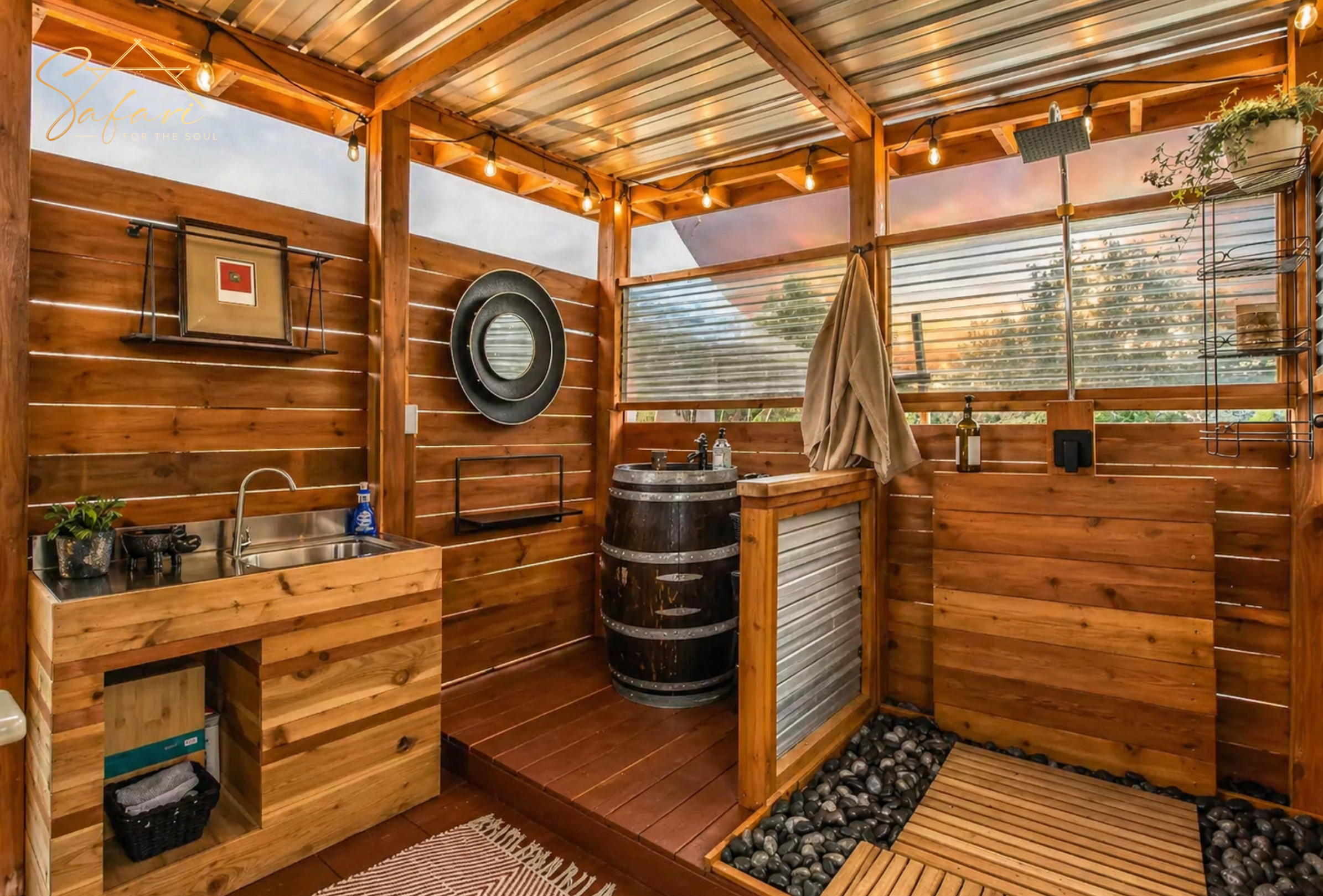 Private outdoor luxury bathroom with shower, vanity sink, and rustic wood finishes at Cosmic Nights in Marble Falls, TX.