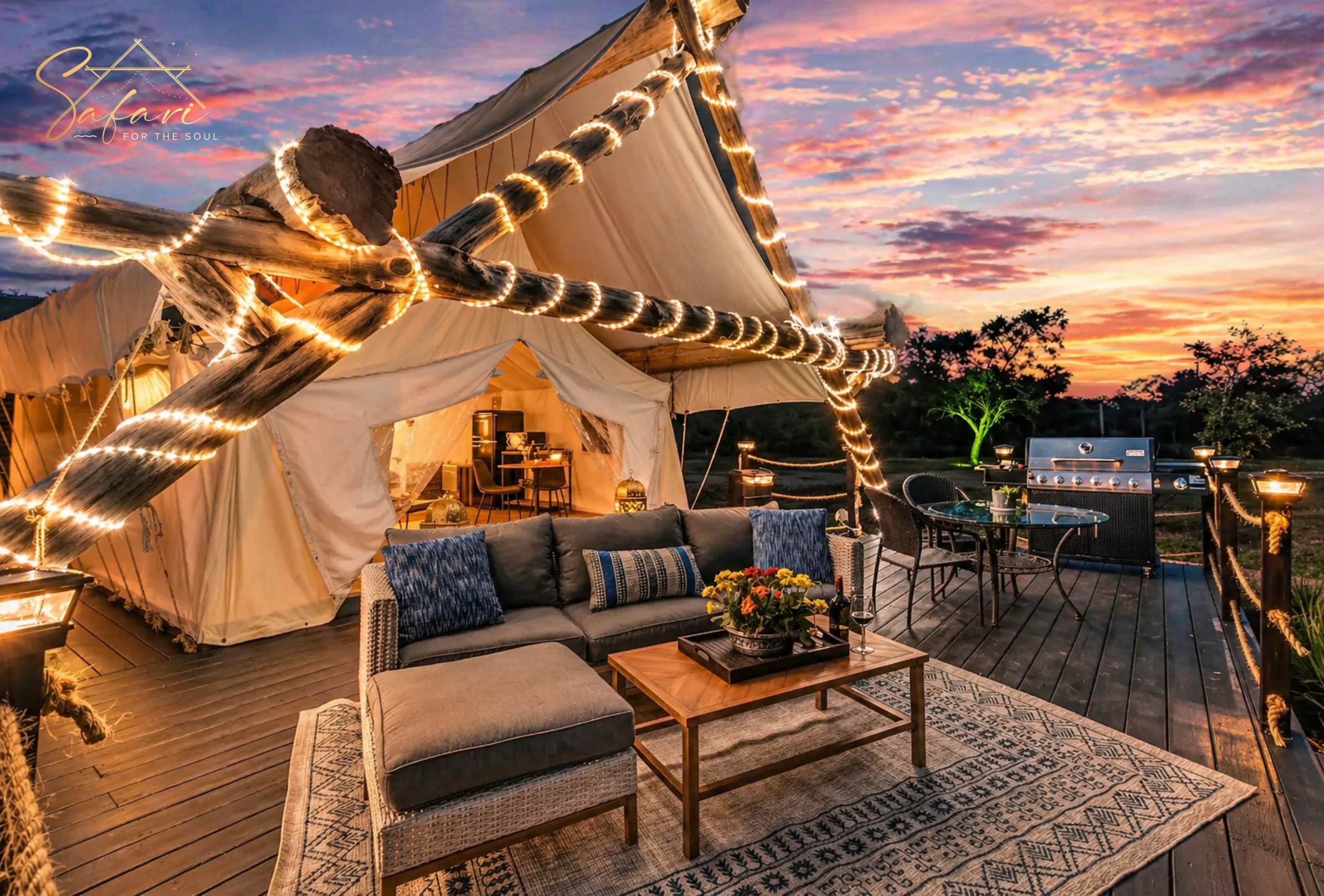 Luxury safari glamping tent with private deck seating, dining area, and sunset sky at Cosmic Nights in Marble Falls, TX.