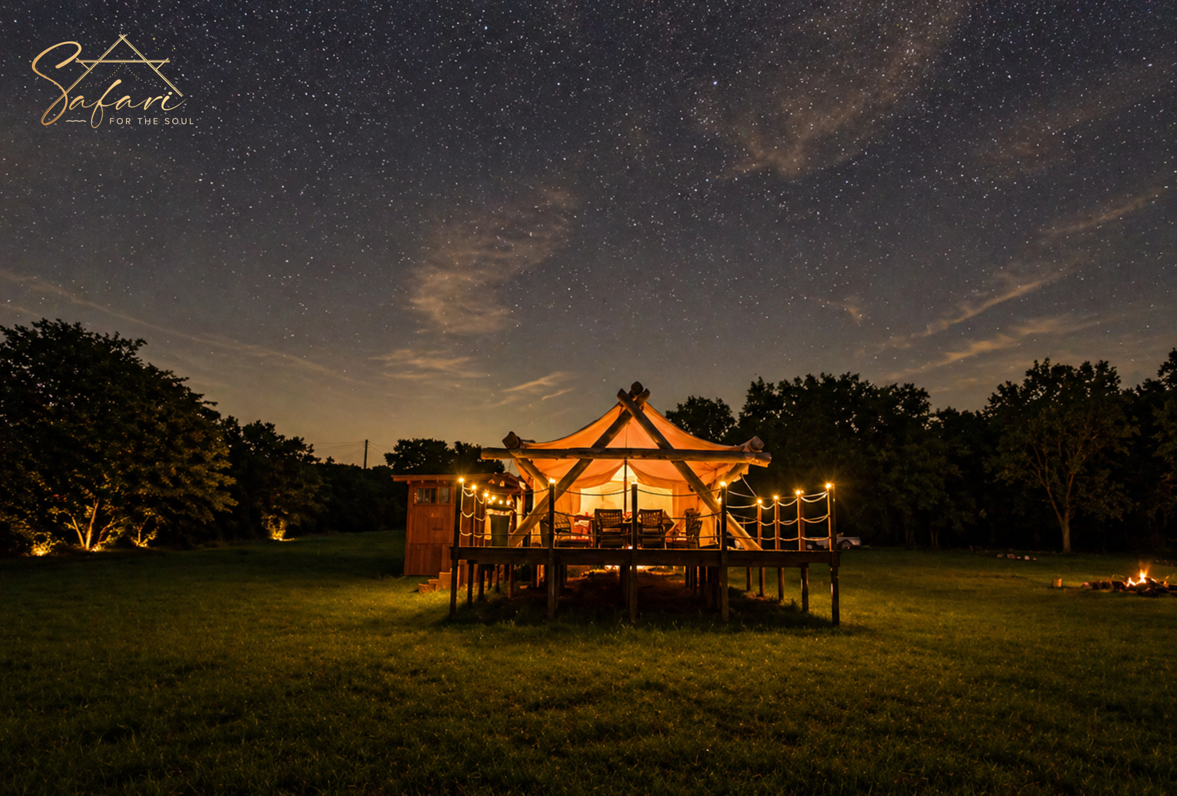Luxury glamping bedroom with canopy bed, cozy sofa, and elegant decor inside safari tent