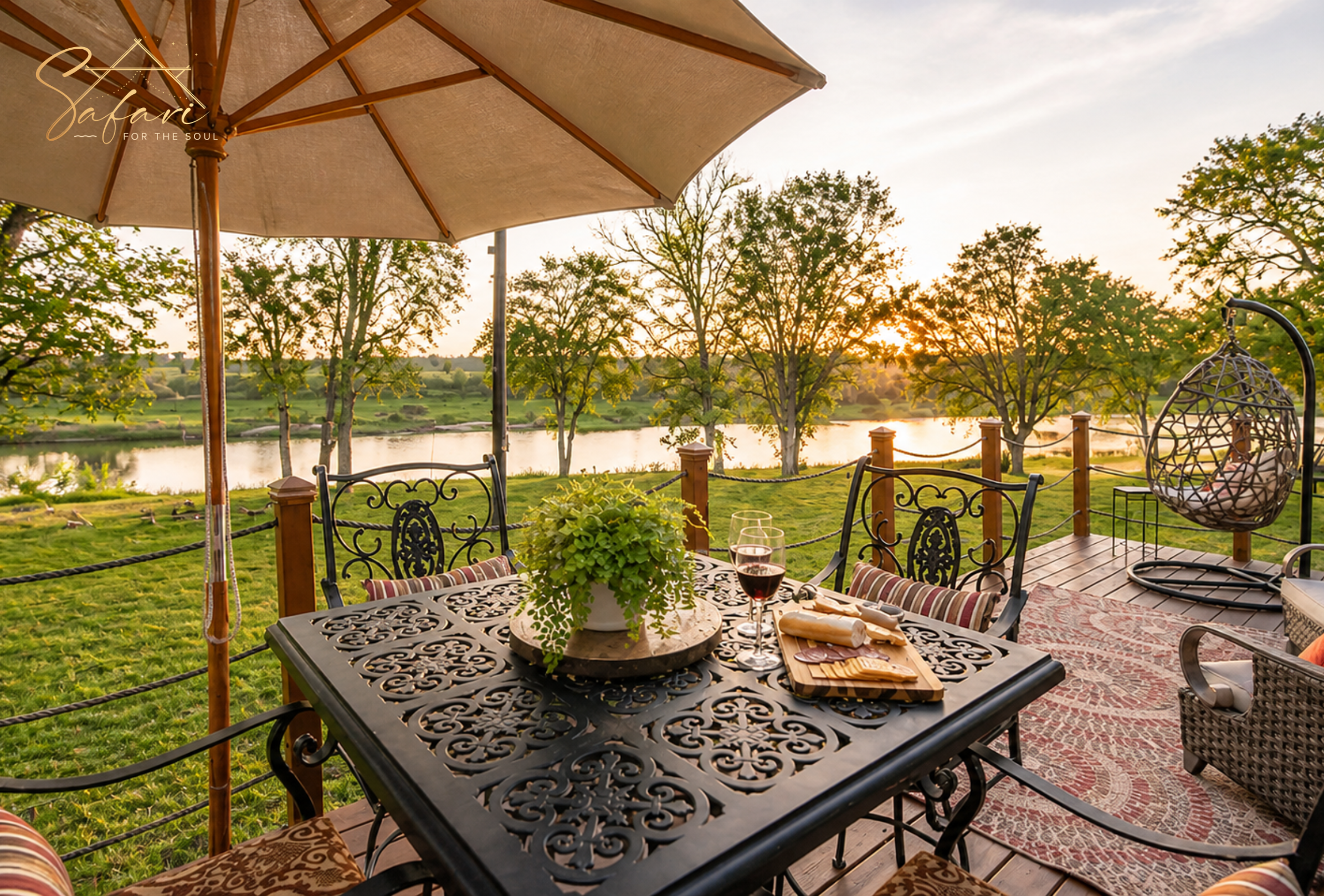 Outdoor dining table with wine and river view at luxury yurt Marble Falls
