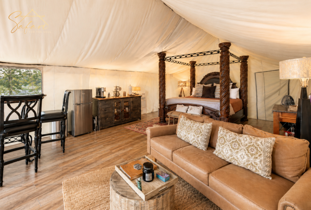 Luxury yurt interior bedroom with king bed and cozy seating Marble Falls Texas