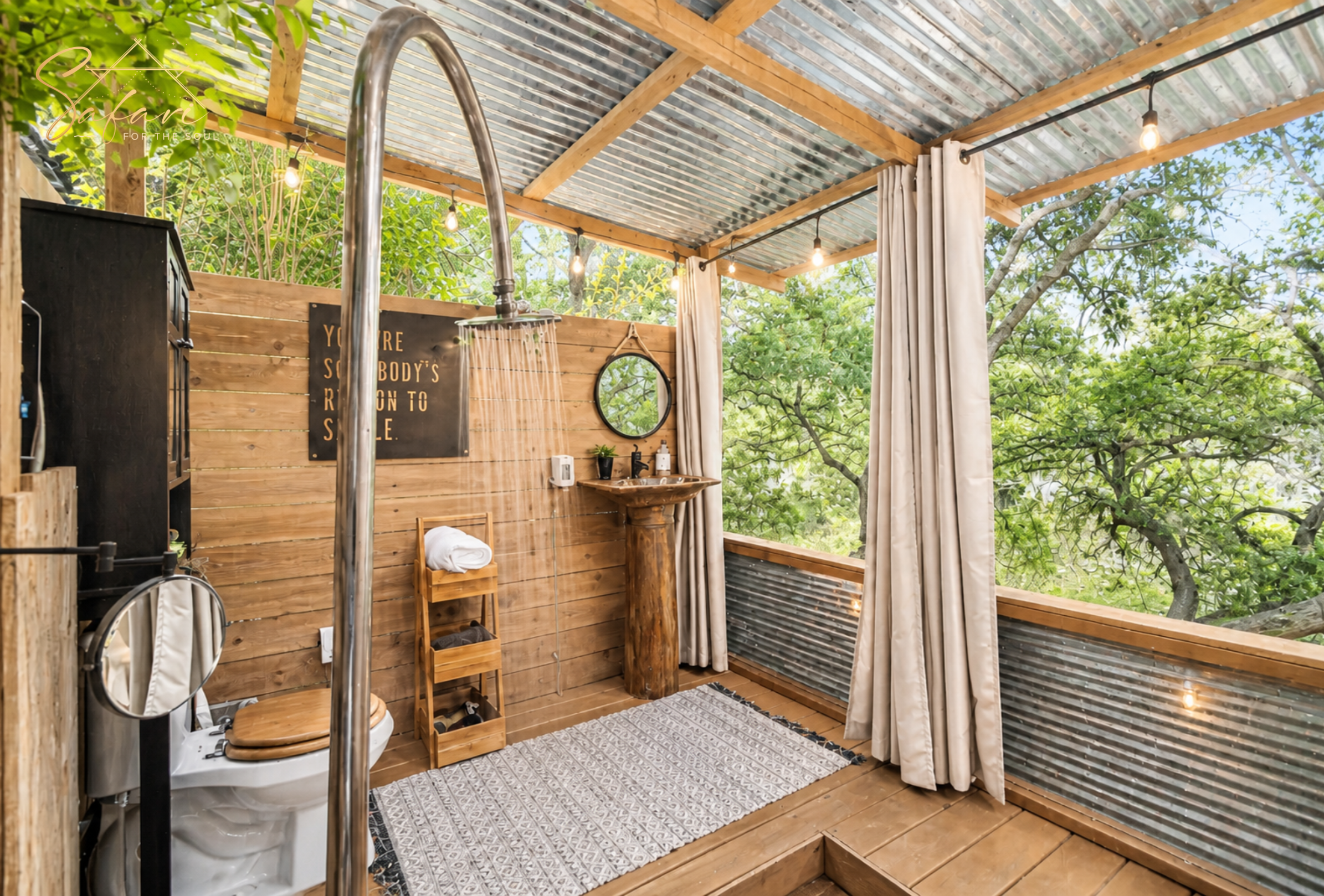 Open air outdoor shower with wooden walls and nature views in luxury glamping setup  Title: Tentation Yurt – Spicewood, TX 3 | Outdoor Shower Experience