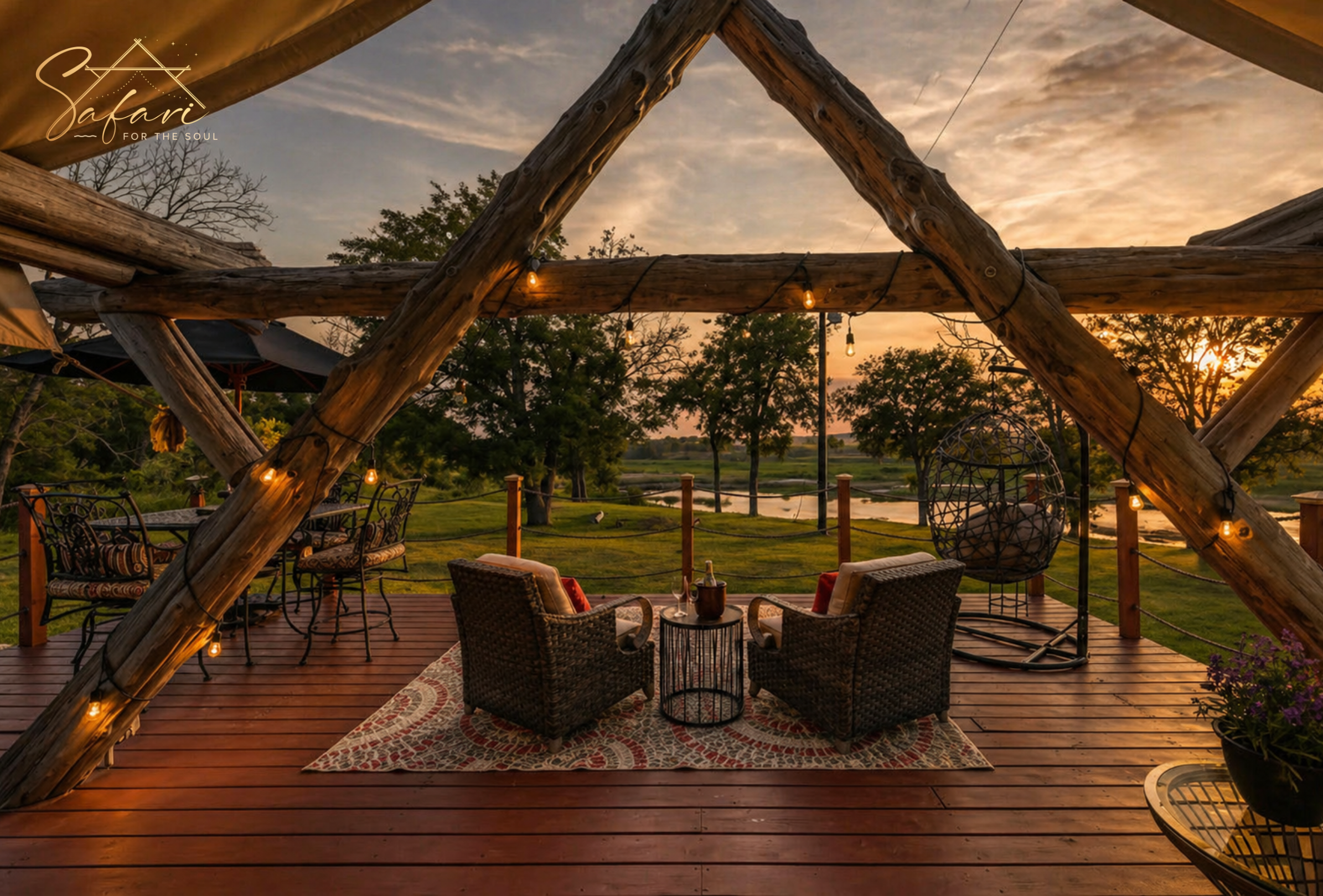 Romantic outdoor deck seating with wooden frame, string lights, and sunset view overlooking nature