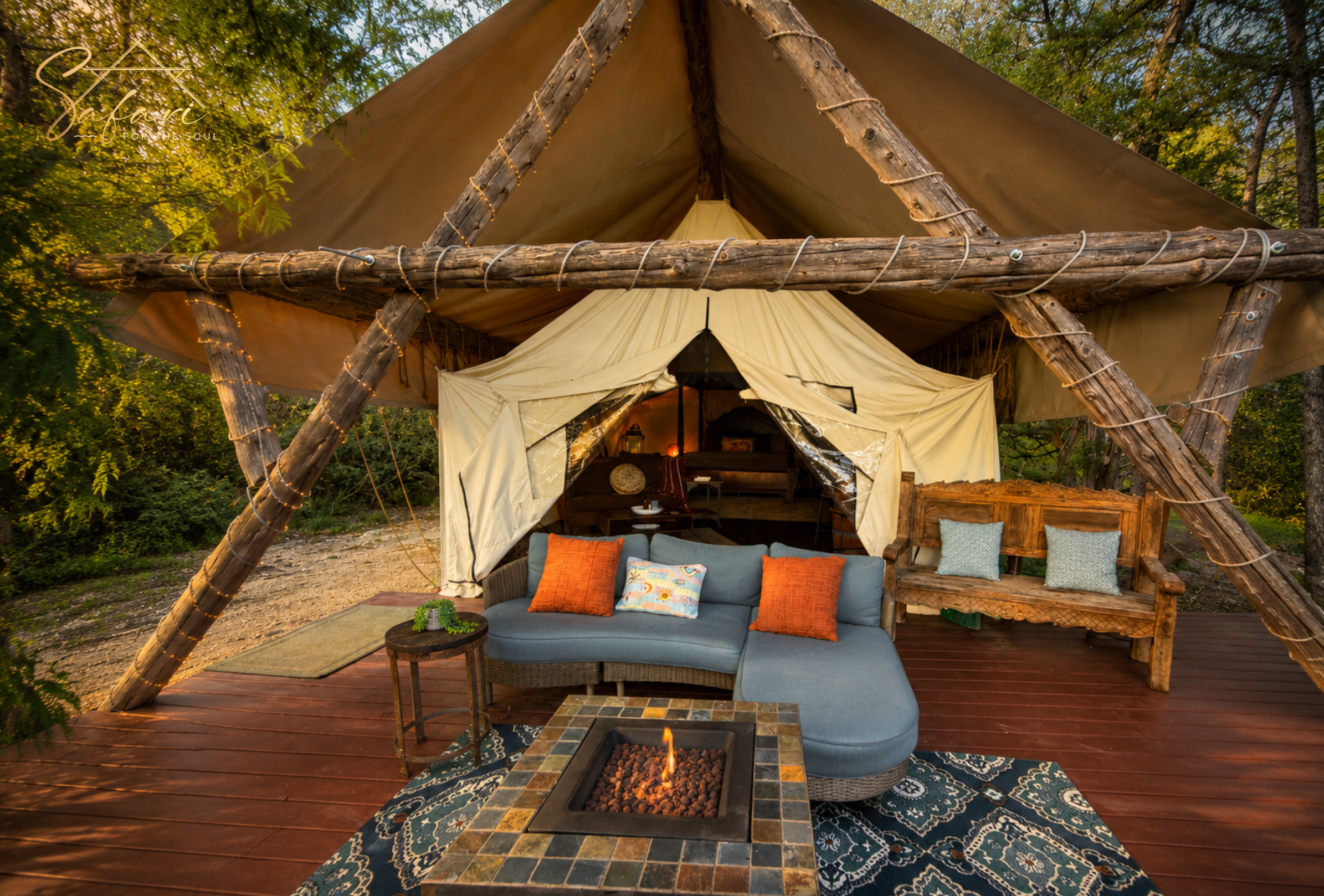 Luxury Tentation Yurt outdoor lounge with fire pit and deck seating in Spicewood Texas