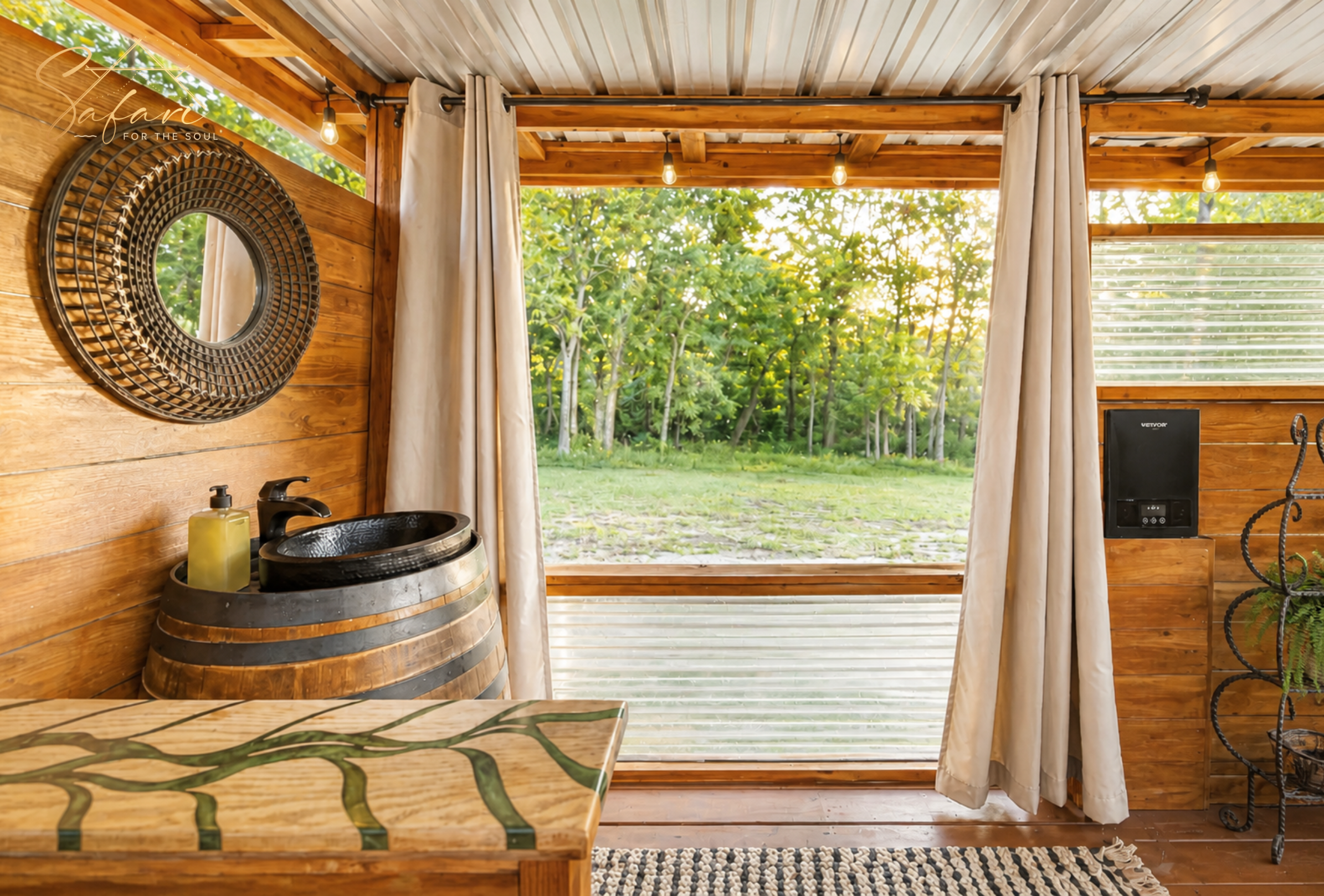 Rustic sink and mirror setup with wooden decor and outdoor view in glamping bathroom