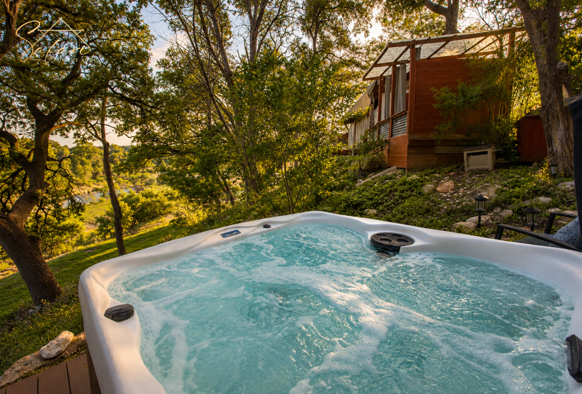 Private hot tub surrounded by nature at Tentation Yurt in Spicewood Texas