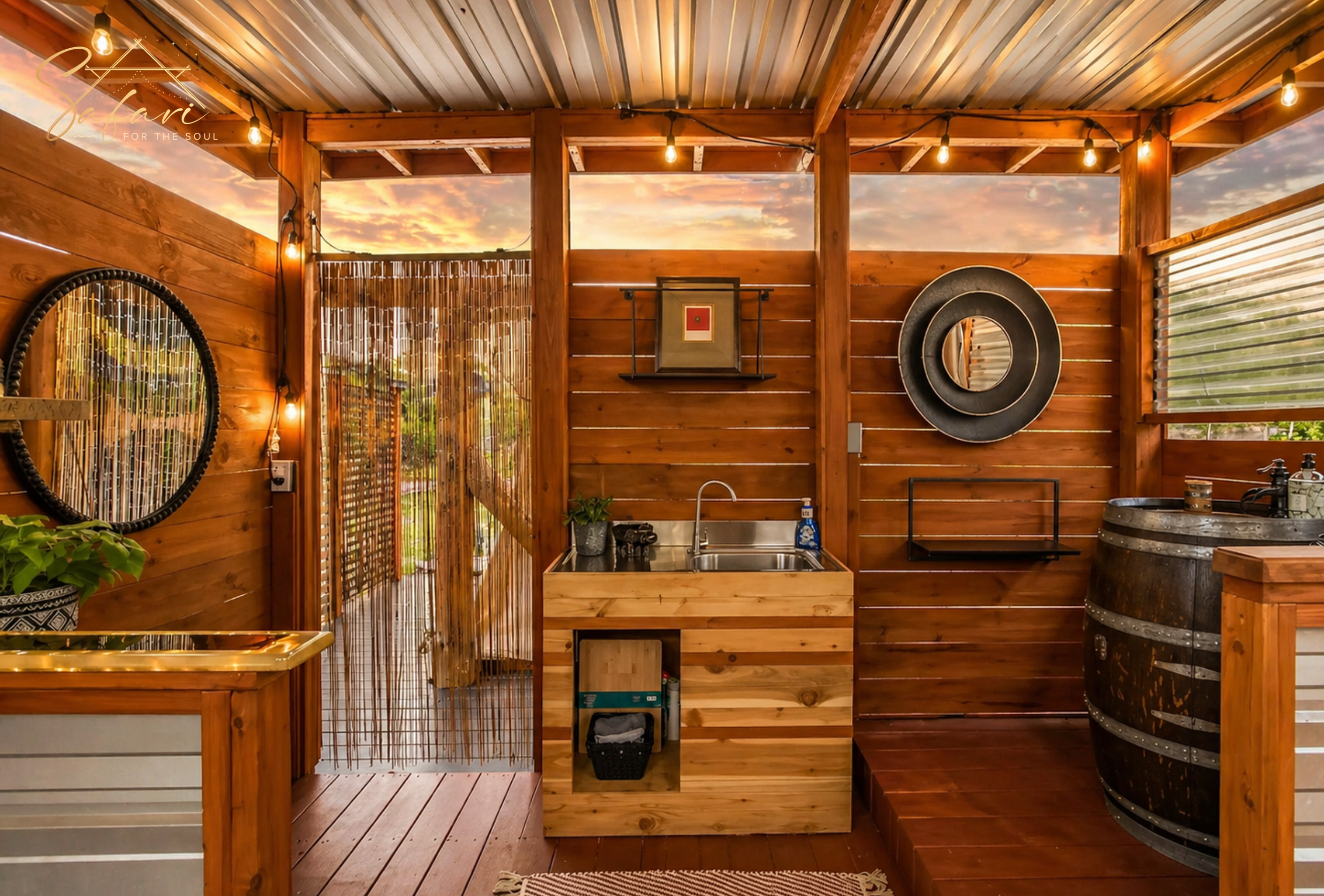 Rustic outdoor bathroom with wooden sink, mirror, barrel vanity and warm lighting at glamping retreat in Marble Falls Texas