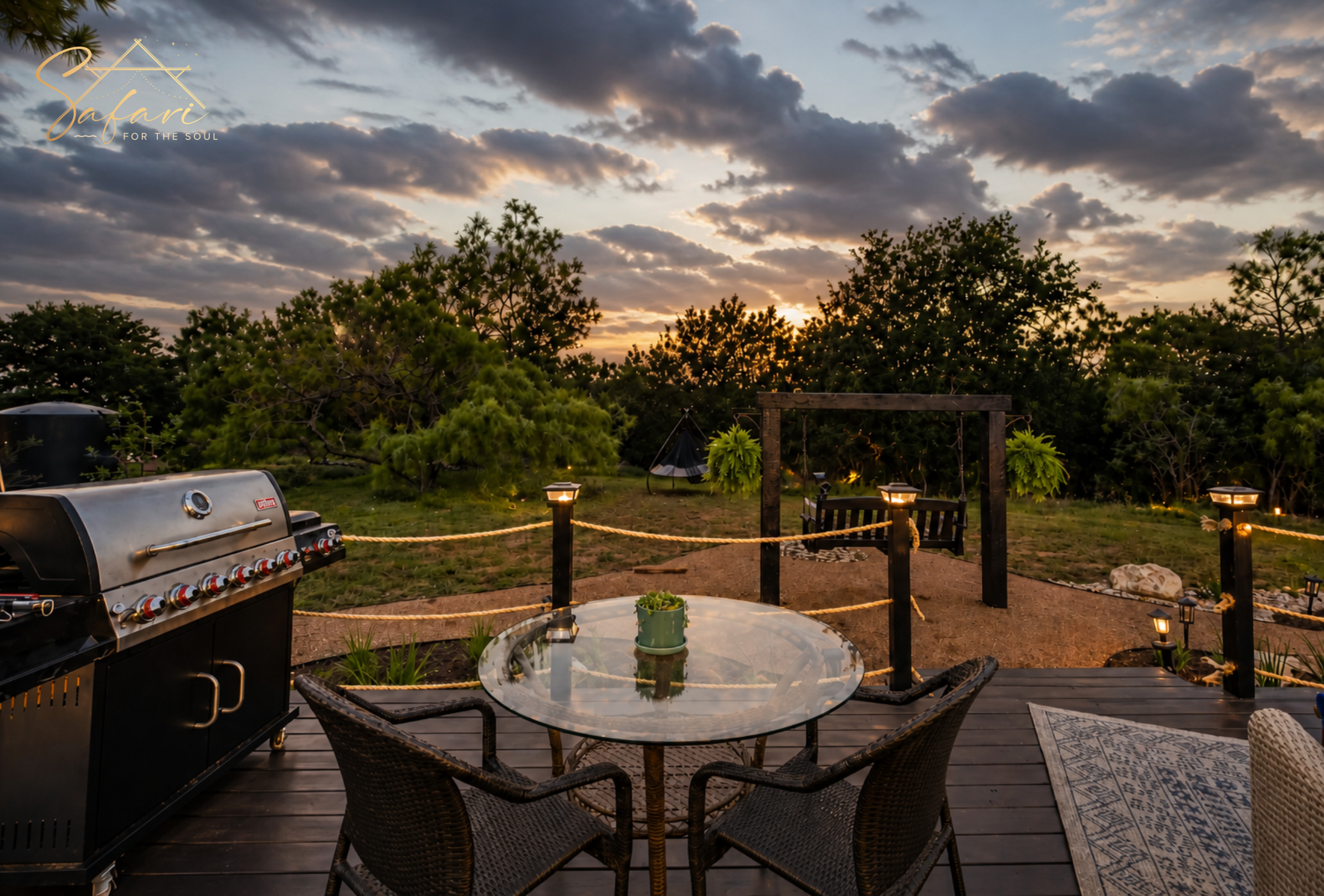 Outdoor dining table and grill on private deck at sunset luxury glamping Marble Falls TX