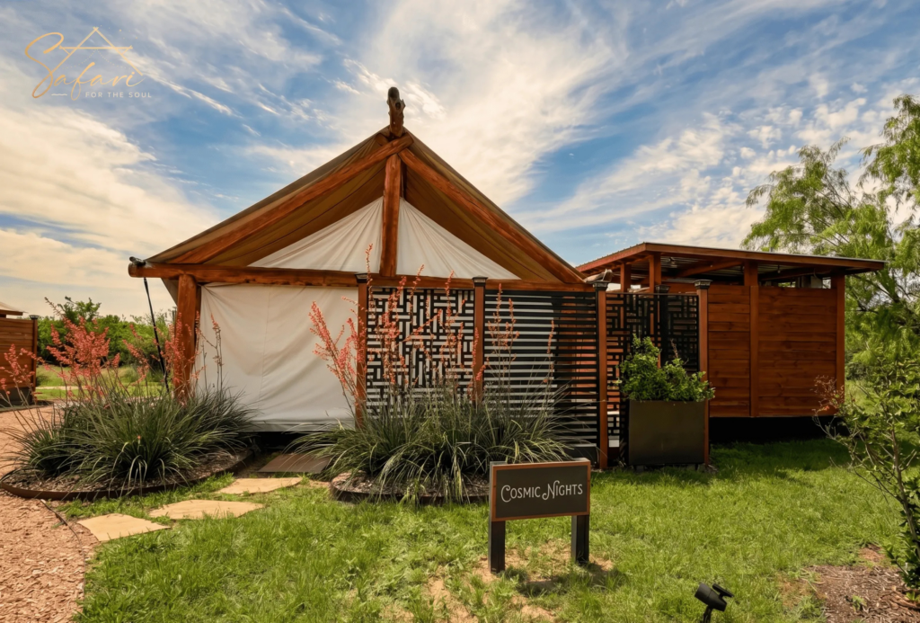 Front exterior view of Cosmic Nights luxury glamping yurt in Marble Falls Texas with landscaped entrance and modern outdoor design