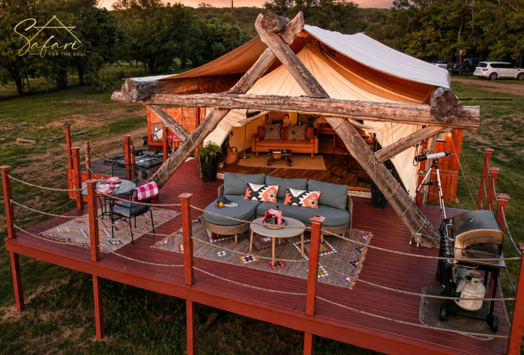 Luxury safari-style yurt with wooden deck, outdoor seating, and scenic nature views in Marble Falls Texas