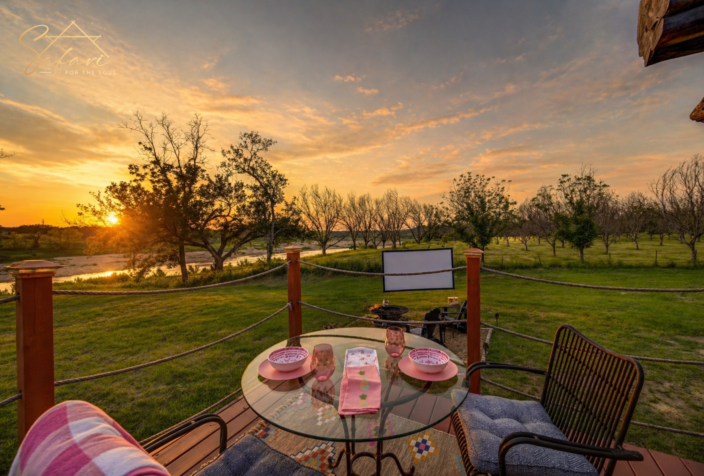 Outdoor dining setup overlooking river and sunset view near luxury yurt in Marble Falls Texas