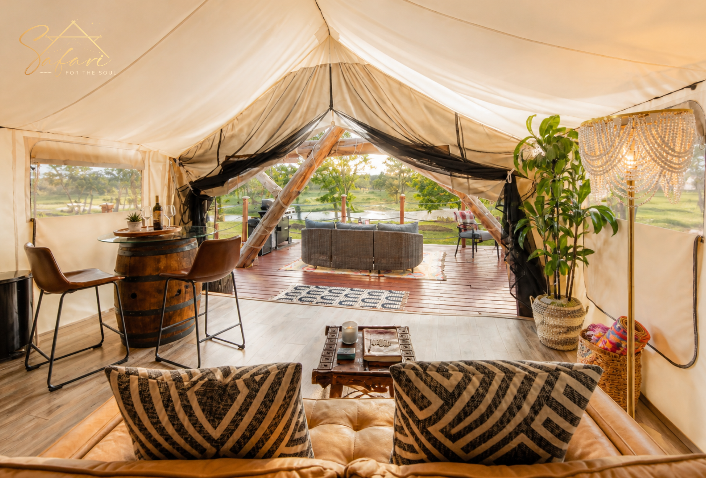 Interior view looking out from yurt to scenic deck and nature landscape in Marble Falls Texas