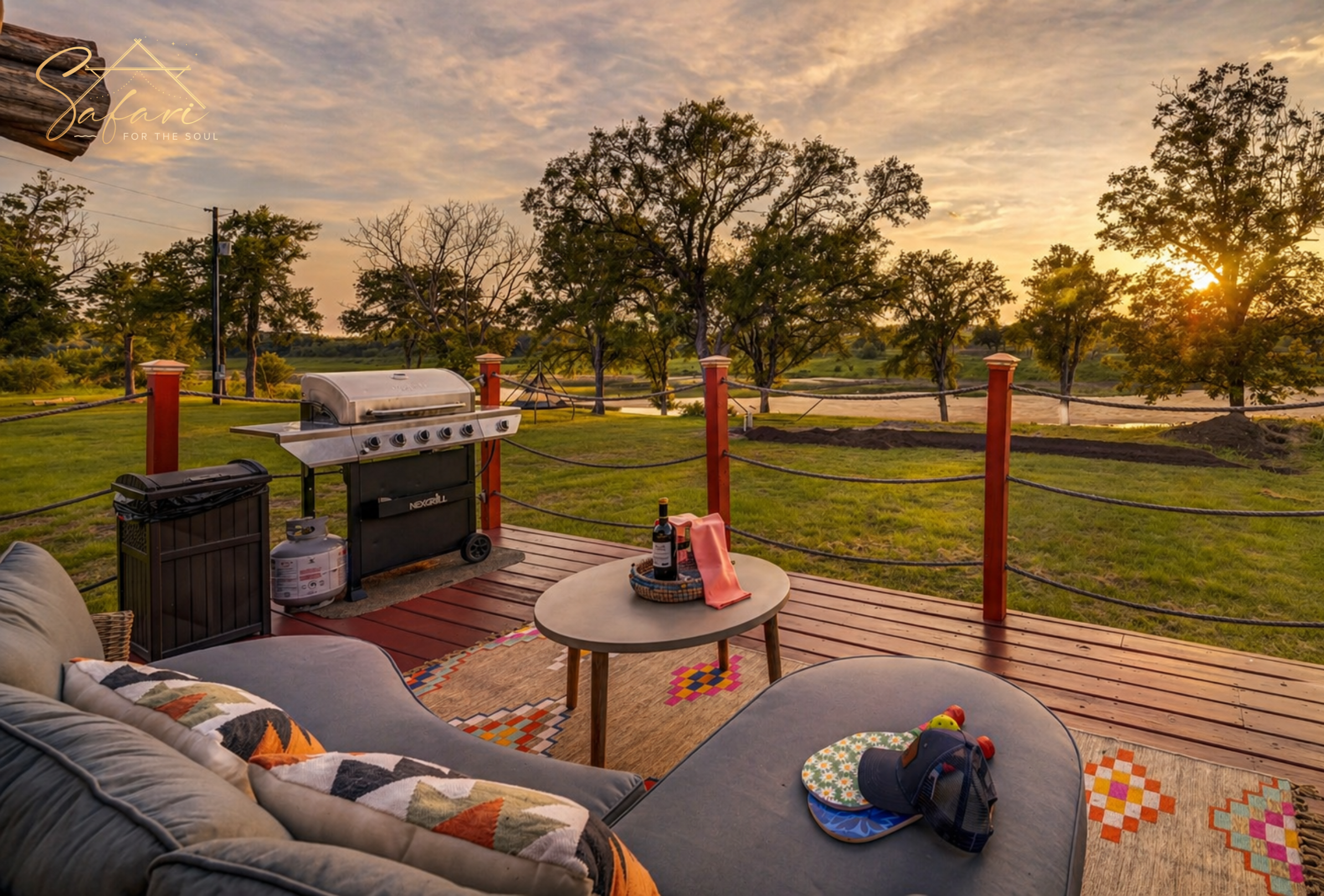 Outdoor lounge area with grill and sunset view at glamping yurt in Marble Falls Texas